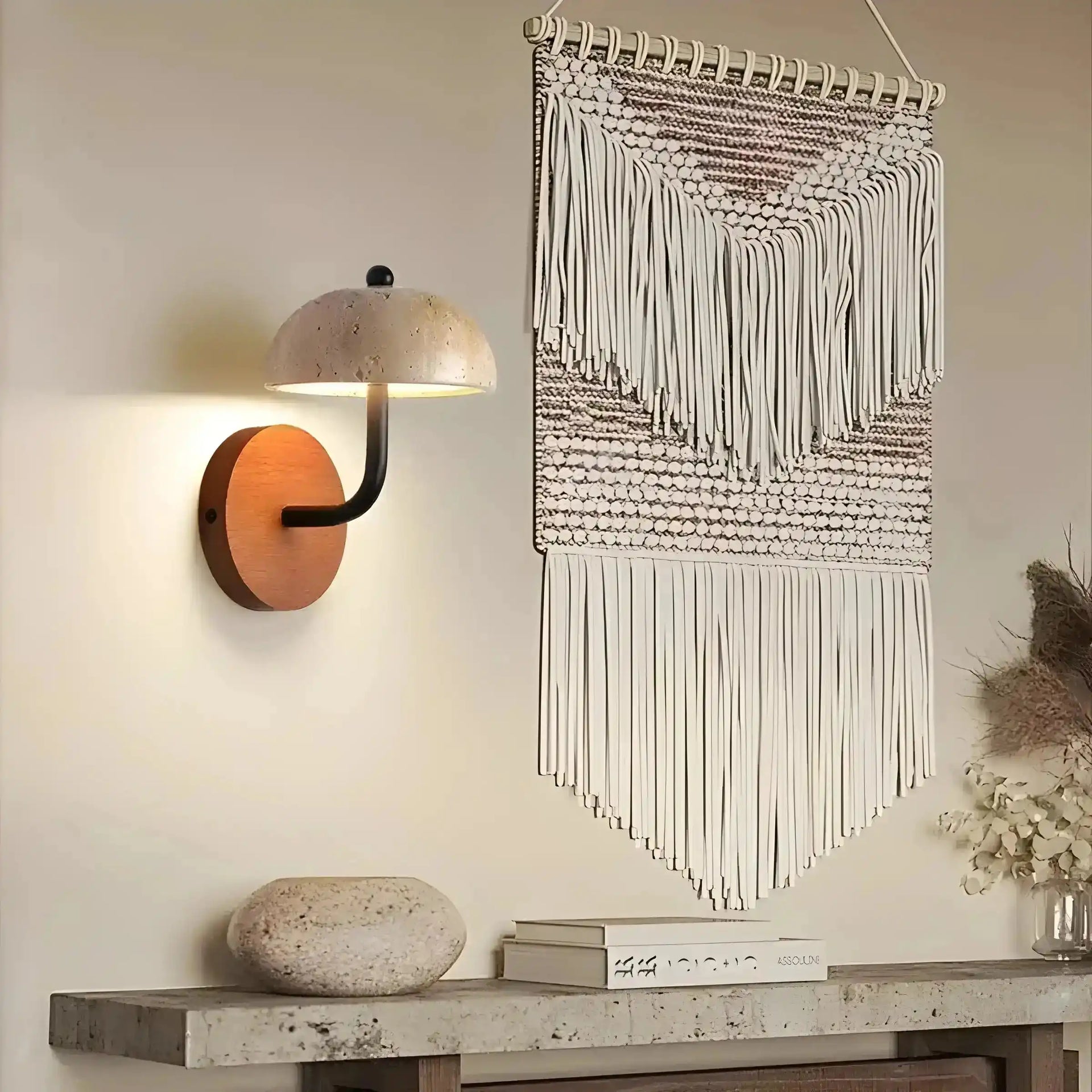 Macramé wall hanging with geometric patterns and fringed tassels.