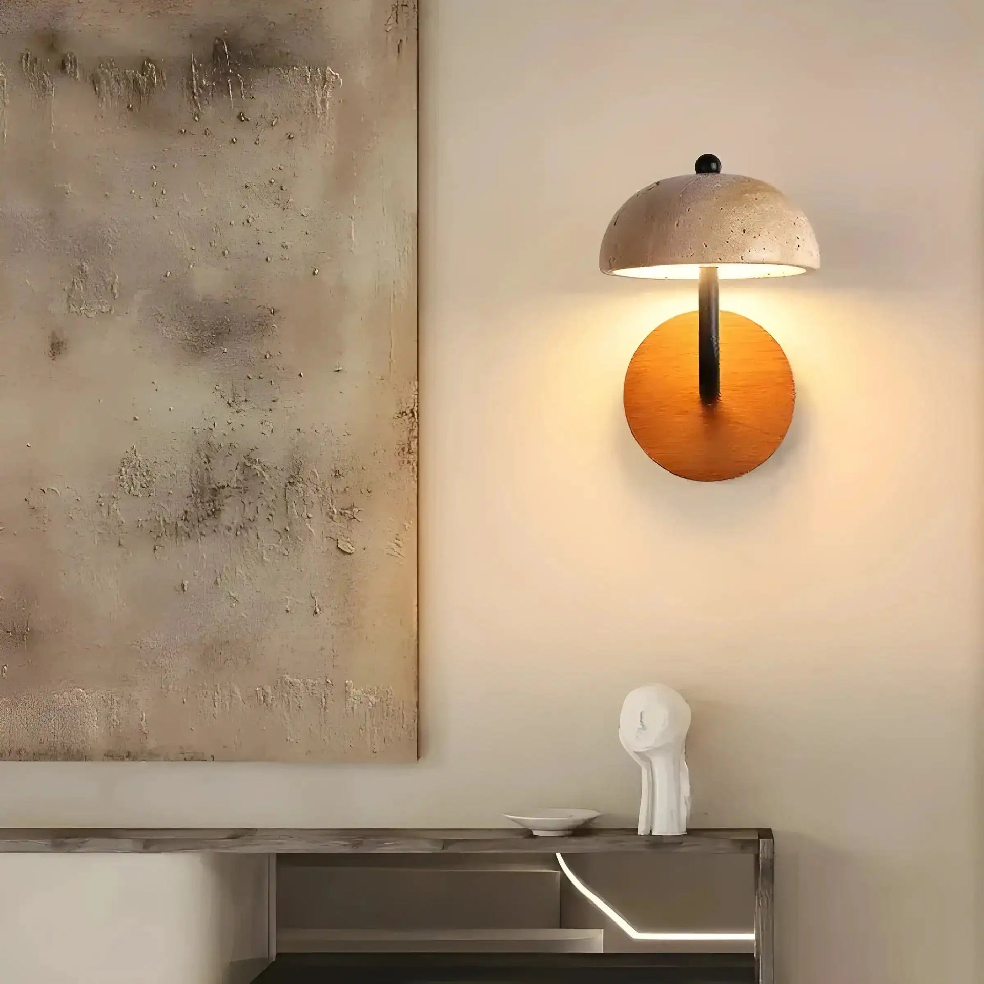 Wall-mounted lamp with a dome-shaped shade and circular orange base.