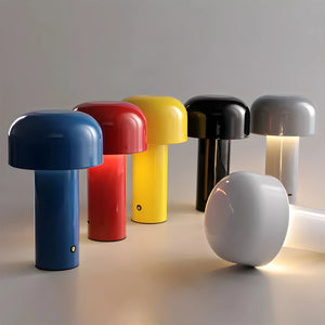 Colorful mushroom-shaped table lamps with rounded tops and cylindrical bases.