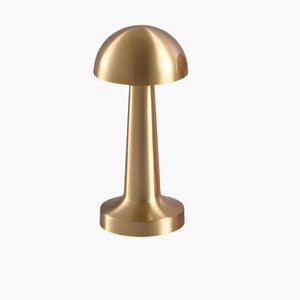 Gold-colored mushroom-shaped table lamp with a dome top and cylindrical base.