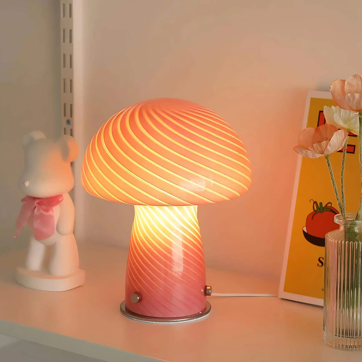 Glowing mushroom-shaped table lamp with a swirled glass shade.