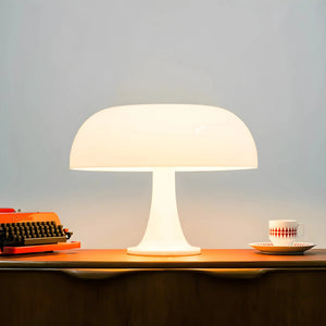 Mushroom-shaped table lamp with a white dome shade.