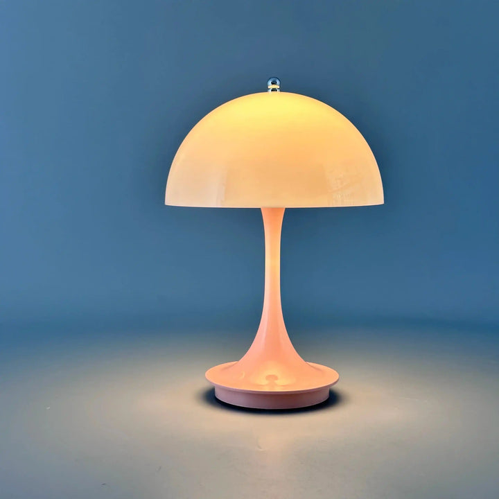 Mushroom-shaped table lamp with a dome shade and slender stem.