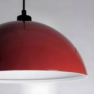 Red dome-shaped pendant lamp with a white interior.