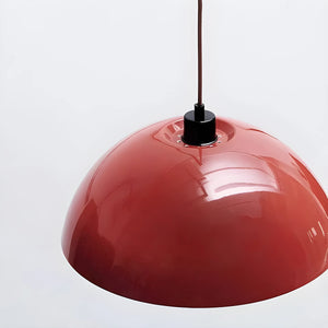 Red dome-shaped pendant light fixture with a glossy finish.