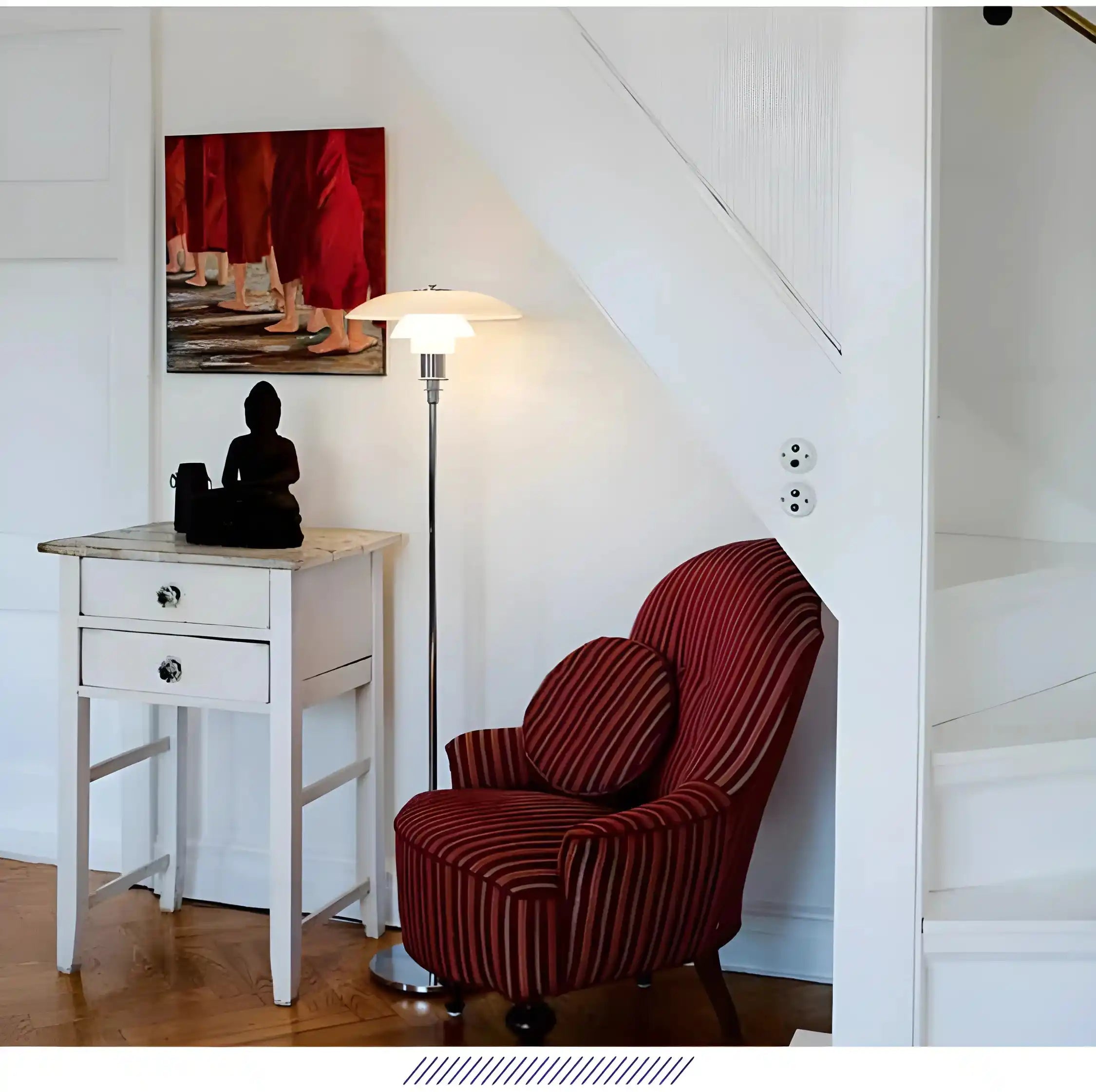 Red striped armchair with a curved, rounded shape.