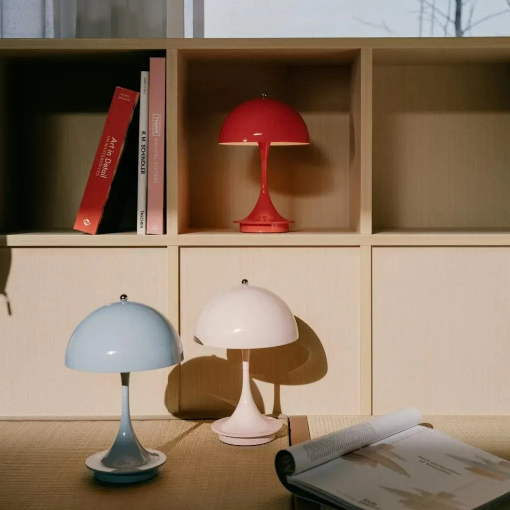 Retro-style table lamps with dome-shaped shades in red, blue, and white colors.