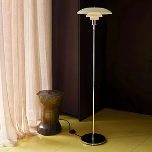 Sleek modern floor lamp with a tiered circular shade.