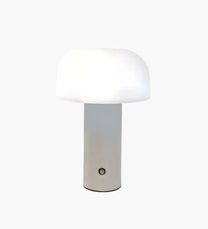 Modern table lamp with a cylindrical base and rounded white shade.